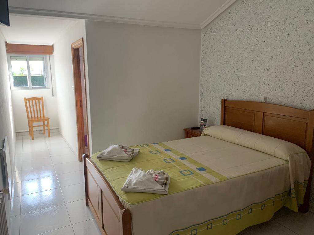 Postel nebo postele na pokoji v ubytování Hostal Sequeiros