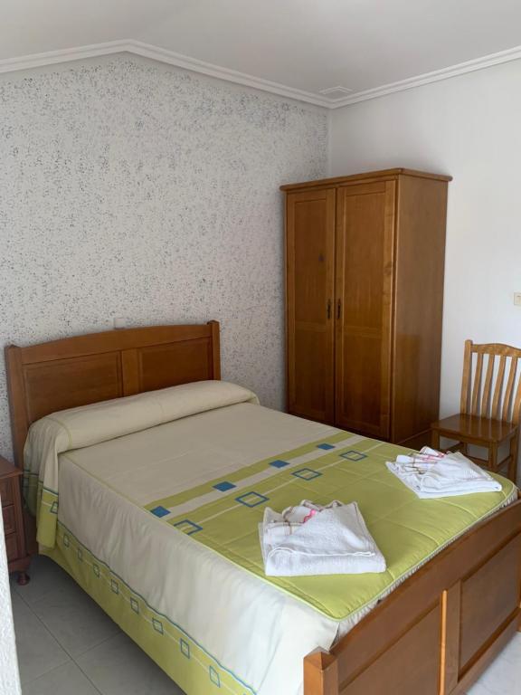 Postel nebo postele na pokoji v ubytování Hostal Sequeiros