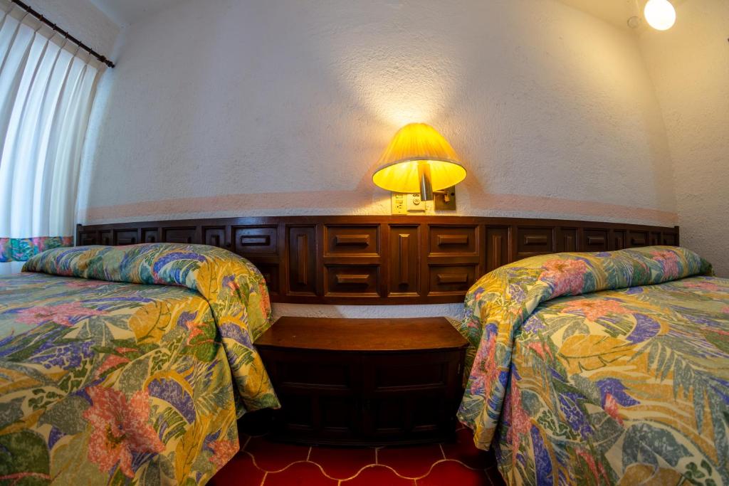 Postel nebo postele na pokoji v ubytování Hotel Delfin