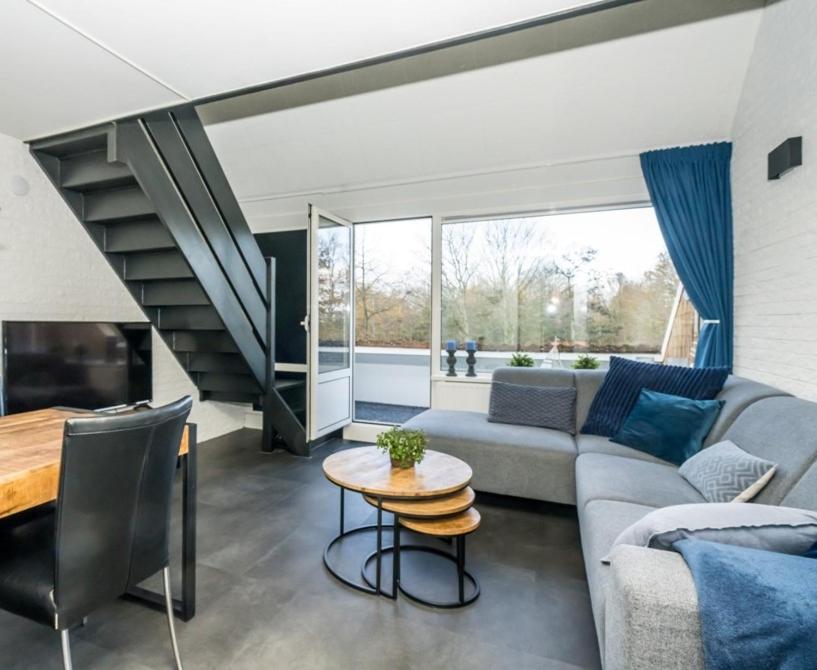 a living room with a couch and a table at Appartement Bru 251 in Bruinisse