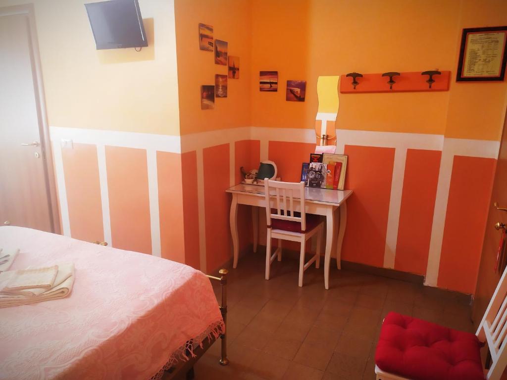 Postel nebo postele na pokoji v ubytování Hotel Serenella
