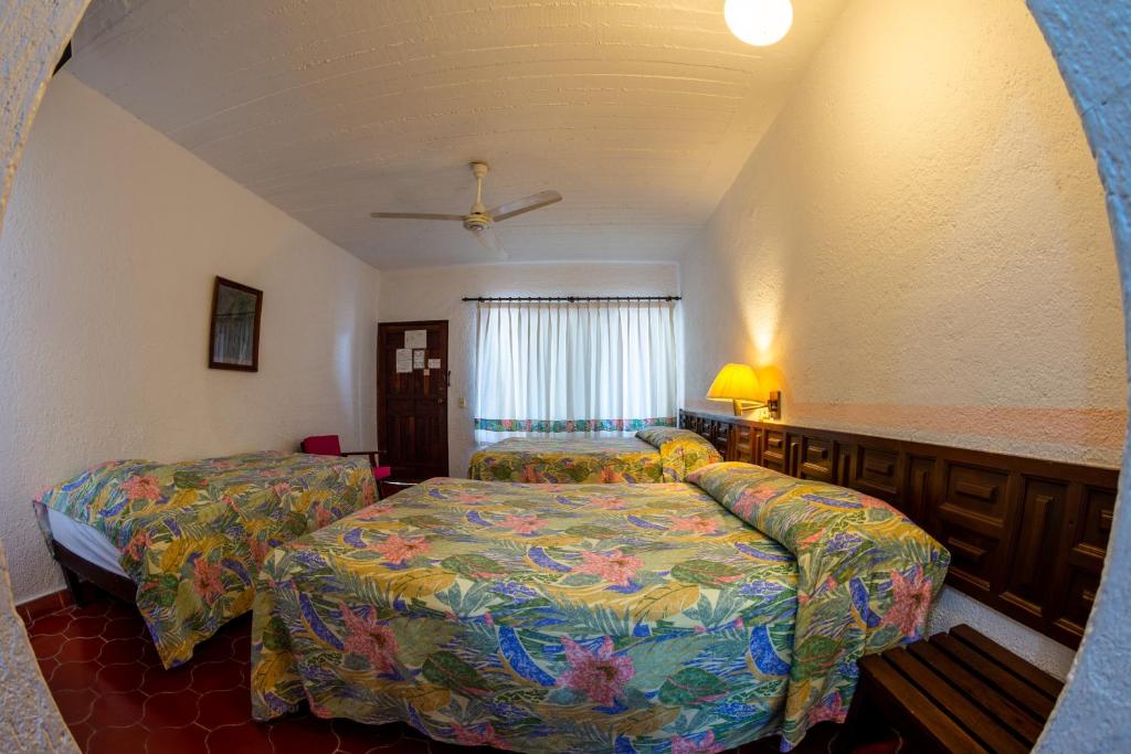 Postel nebo postele na pokoji v ubytování Hotel Delfin