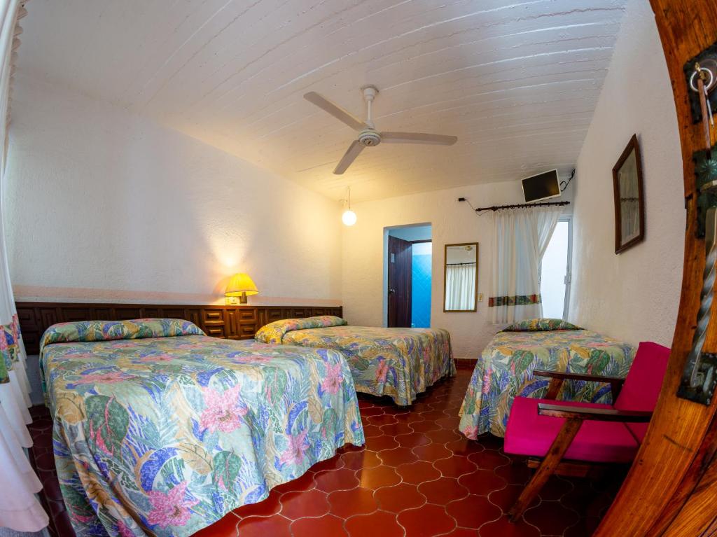 Postel nebo postele na pokoji v ubytování Hotel Delfin