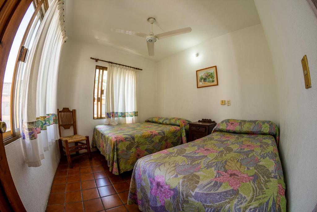 Postel nebo postele na pokoji v ubytování Hotel Delfin