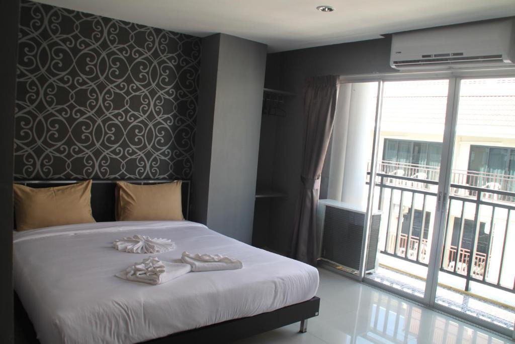 Vuode tai vuoteita majoituspaikassa Sweet Hotel Patong