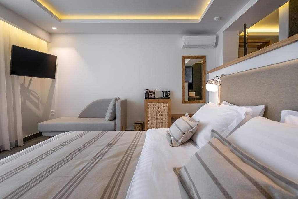 Postel nebo postele na pokoji v ubytování NISSEA Boutique Hotel