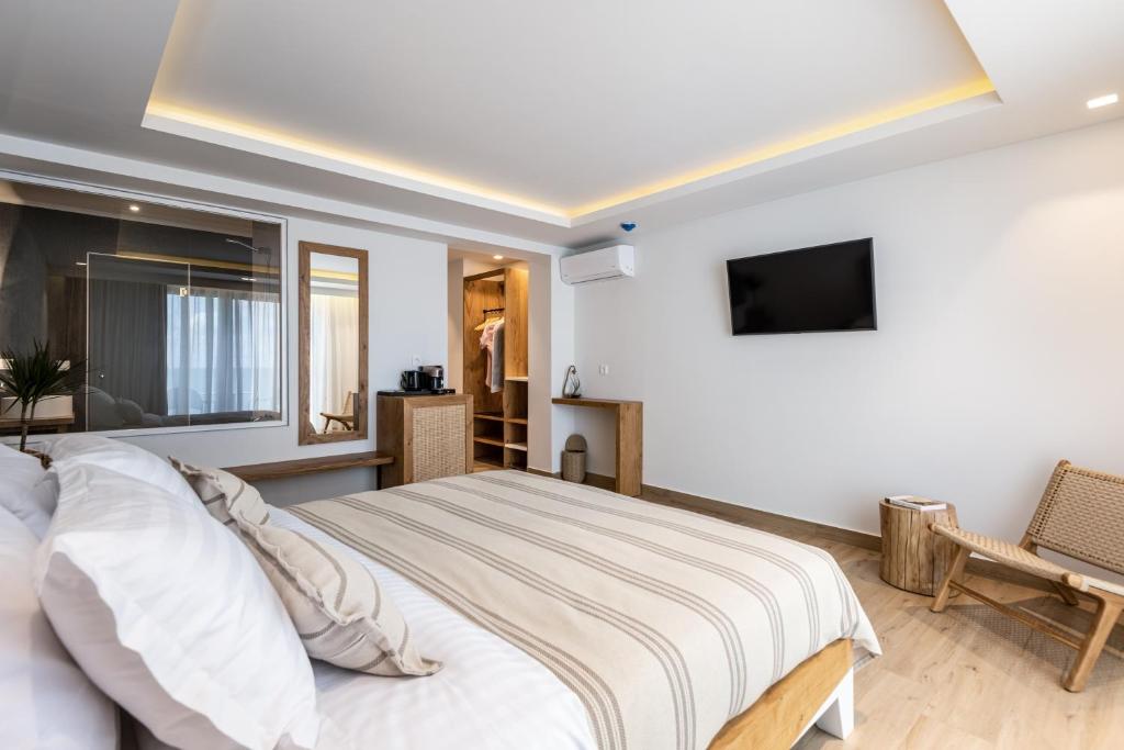 TV a/nebo společenská místnost v ubytování NISSEA Boutique Hotel