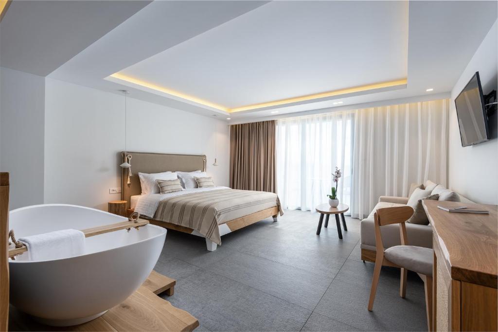 Postel nebo postele na pokoji v ubytování NISSEA Boutique Hotel