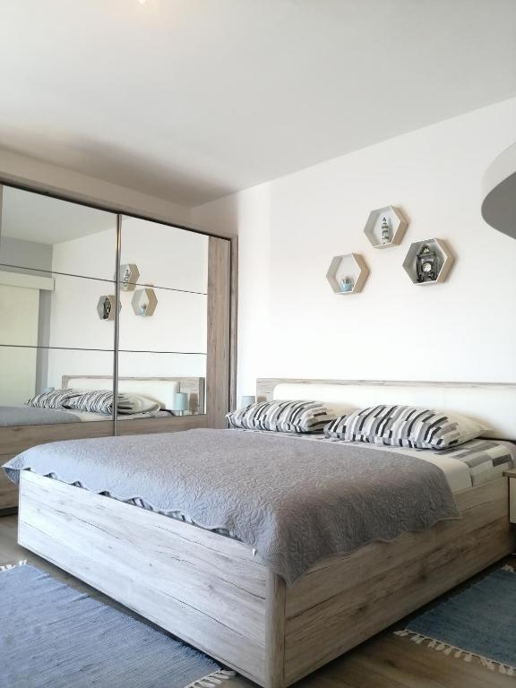 Postel nebo postele na pokoji v ubytování Apartmani Nevena