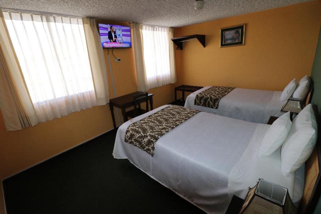 Postel nebo postele na pokoji v ubytování La Posada del Colca