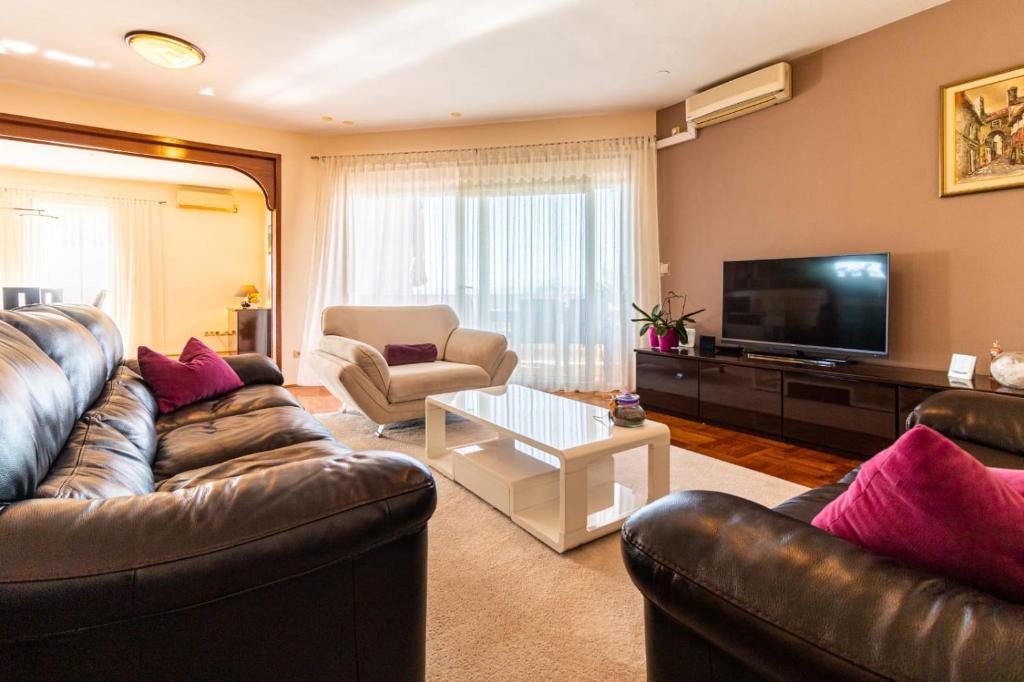 TV a/nebo společenská místnost v ubytování Apartment Escape