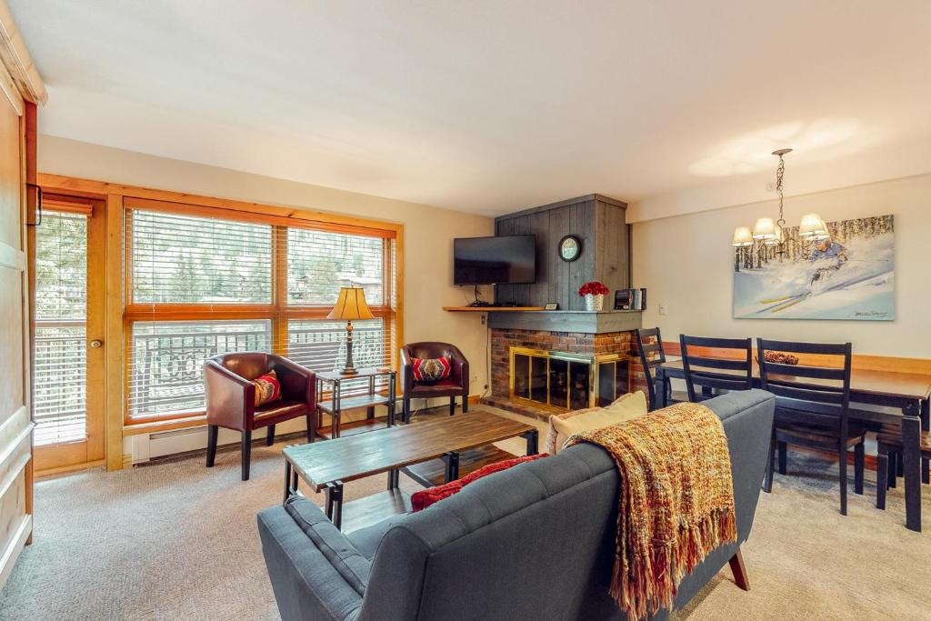 a living room with a couch and a table at Lion Square Lodge South 466 in Vail