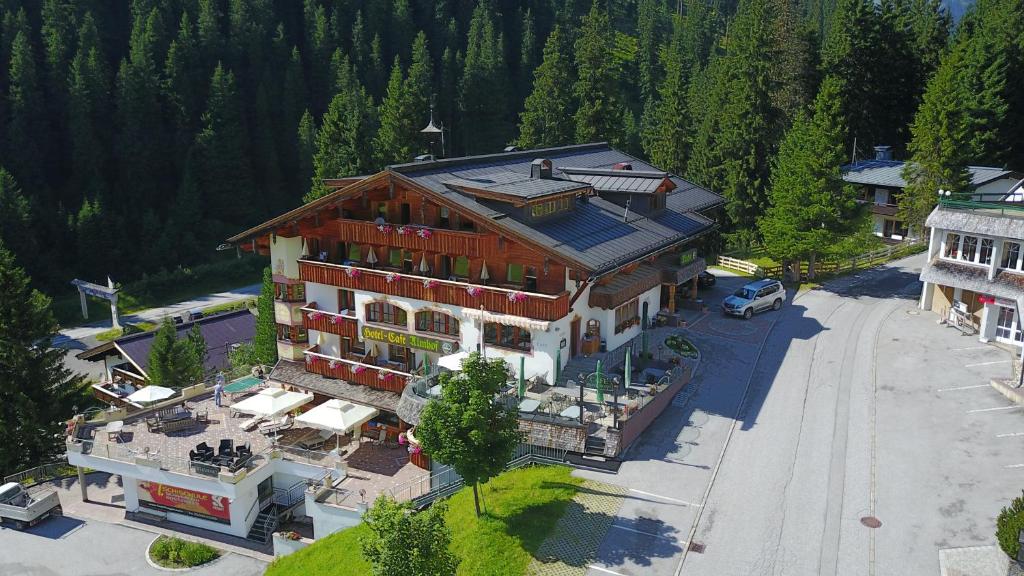 an overhead view of a large building in a forest at Hotel Almhof in Hochfugen