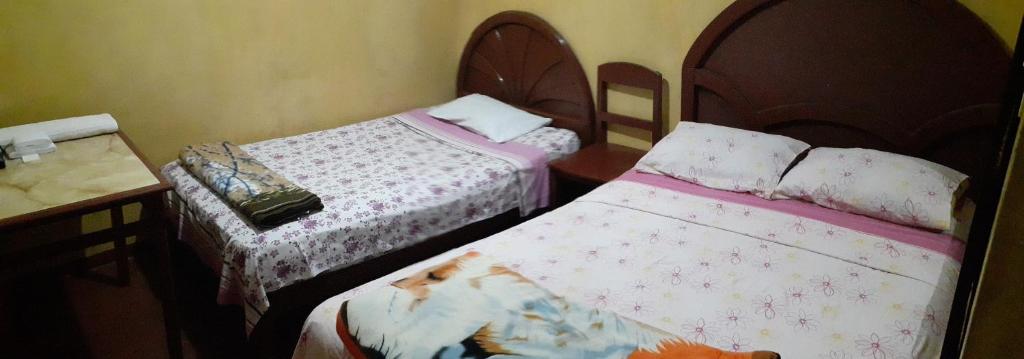 Postel nebo postele na pokoji v ubytování Hostal Jovita