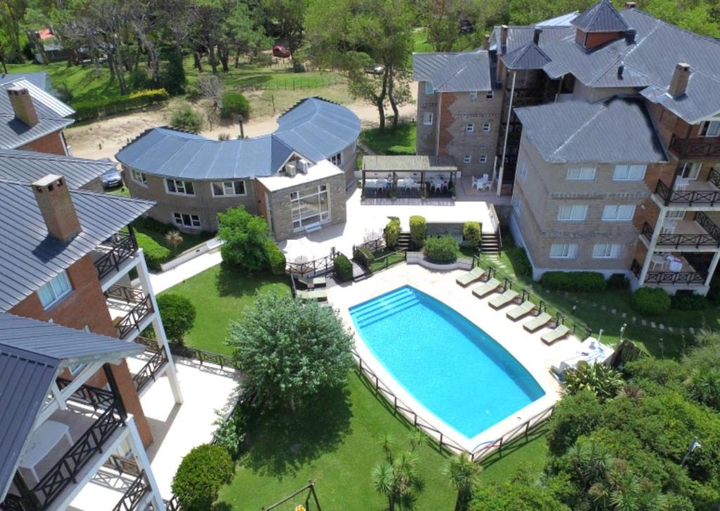 an aerial view of a house with a swimming pool at Victoria Village in Carilo