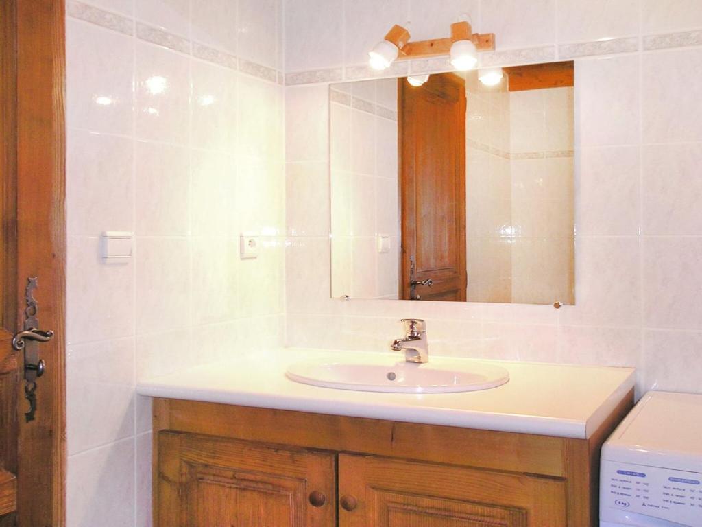 a bathroom with a sink and a mirror at A detached chalet for 6 people with views of Veysonnaz in Le Villard