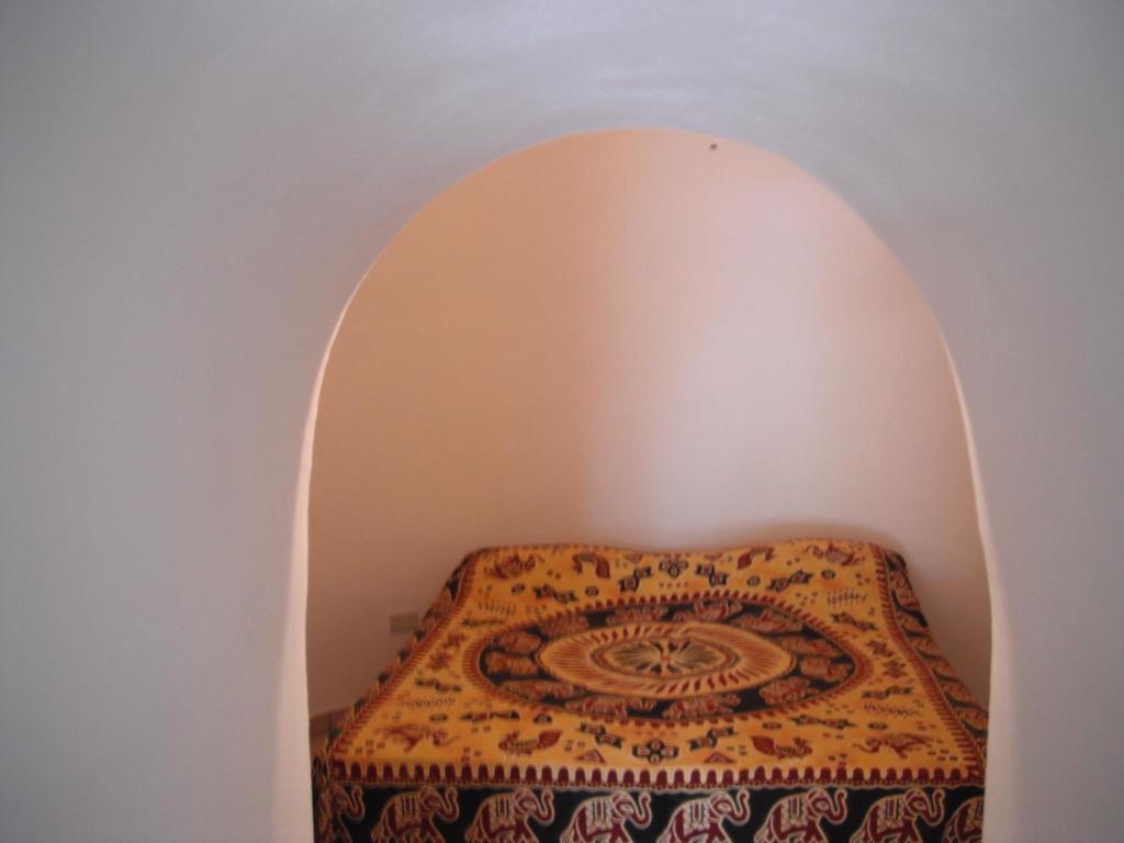 A bed or beds in a room at Villa Trullo di Angela
