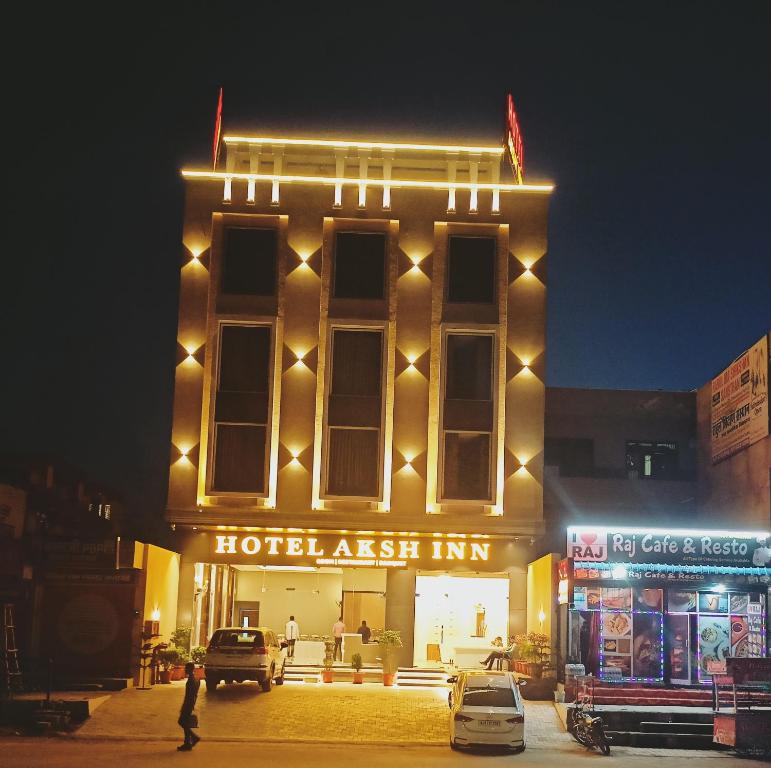 a hotel austin inn at night with lights at Hotel Aksh Inn in Jaipur