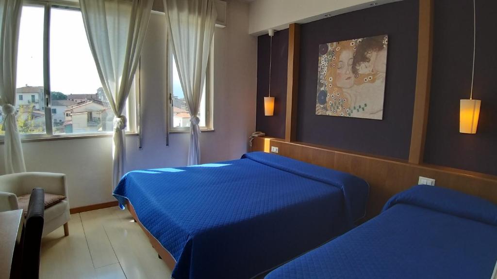 Postel nebo postele na pokoji v ubytování Cavalieri del Tau