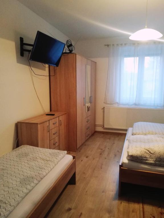 Postel nebo postele na pokoji v ubytování szt.flórián