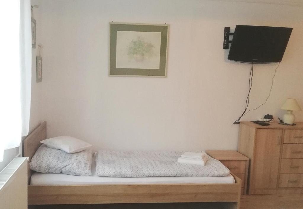 Postel nebo postele na pokoji v ubytování szt.flórián