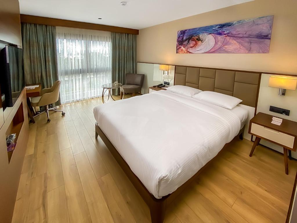 Postel nebo postele na pokoji v ubytování Anemon Kent Aydın Otel