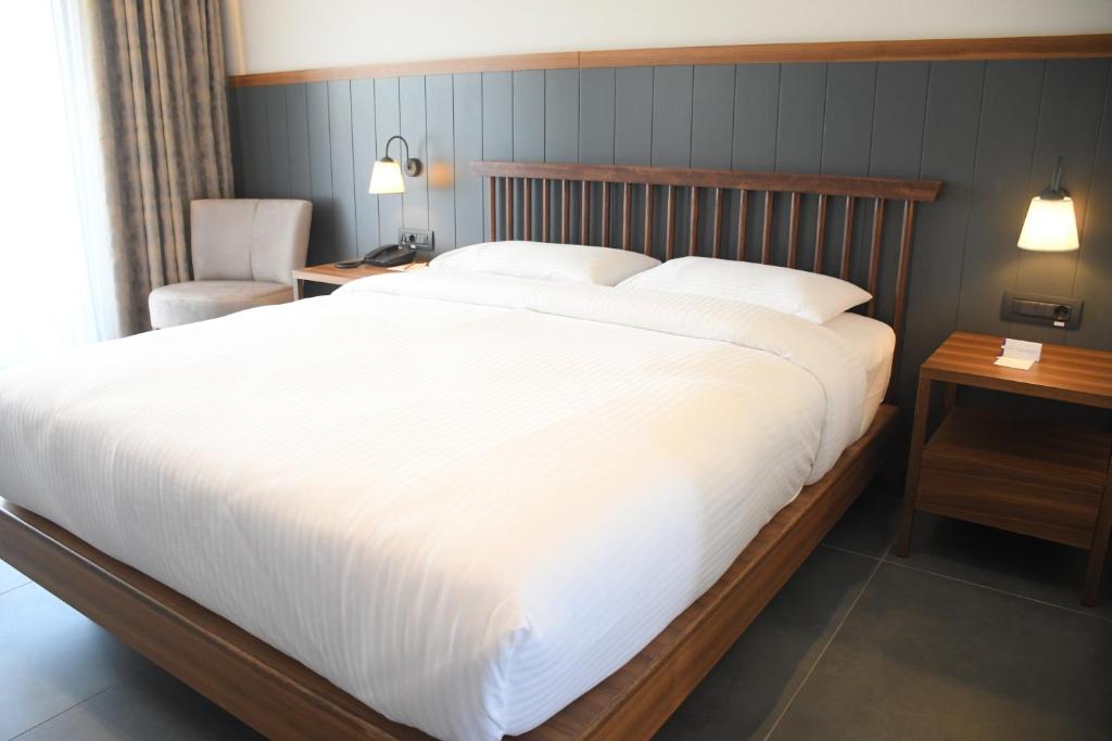 Postel nebo postele na pokoji v ubytování Anemon Kent Aydın Otel