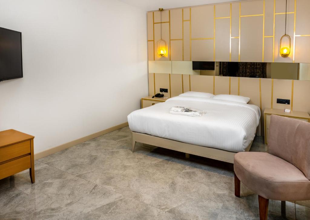 Postel nebo postele na pokoji v ubytování Anemon Kent Aydın Otel