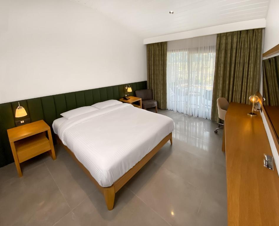 Postel nebo postele na pokoji v ubytování Anemon Kent Aydın Otel