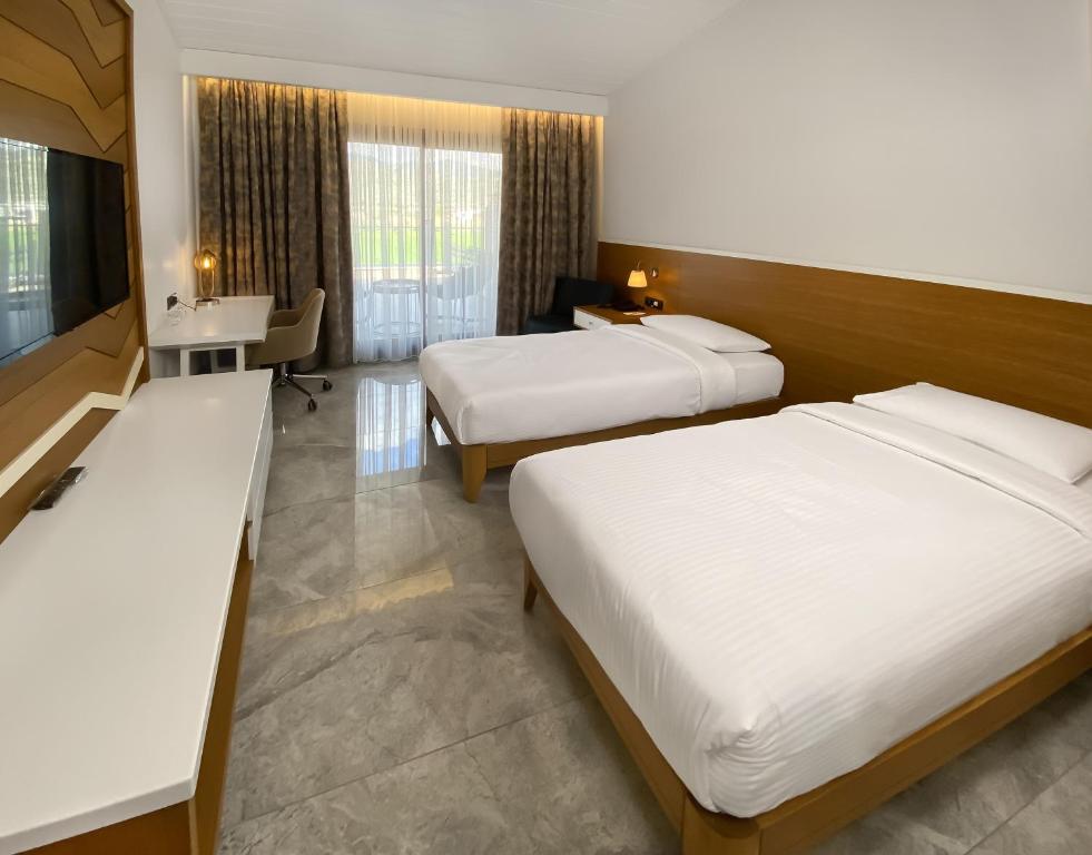 Postel nebo postele na pokoji v ubytování Anemon Kent Aydın Otel