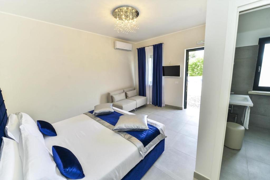 Postel nebo postele na pokoji v ubytování Agriturismo Borgo Imperiale