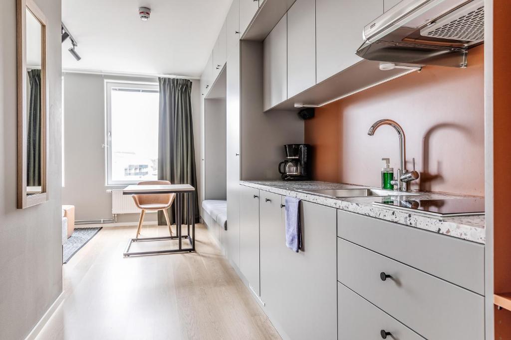 Kuchyň nebo kuchyňský kout v ubytování Part-Time Home Täby
