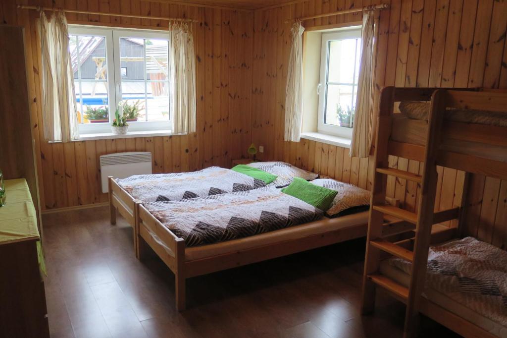Postel nebo postele na pokoji v ubytování Apartments Skiareál U Vodárny Bedřichov