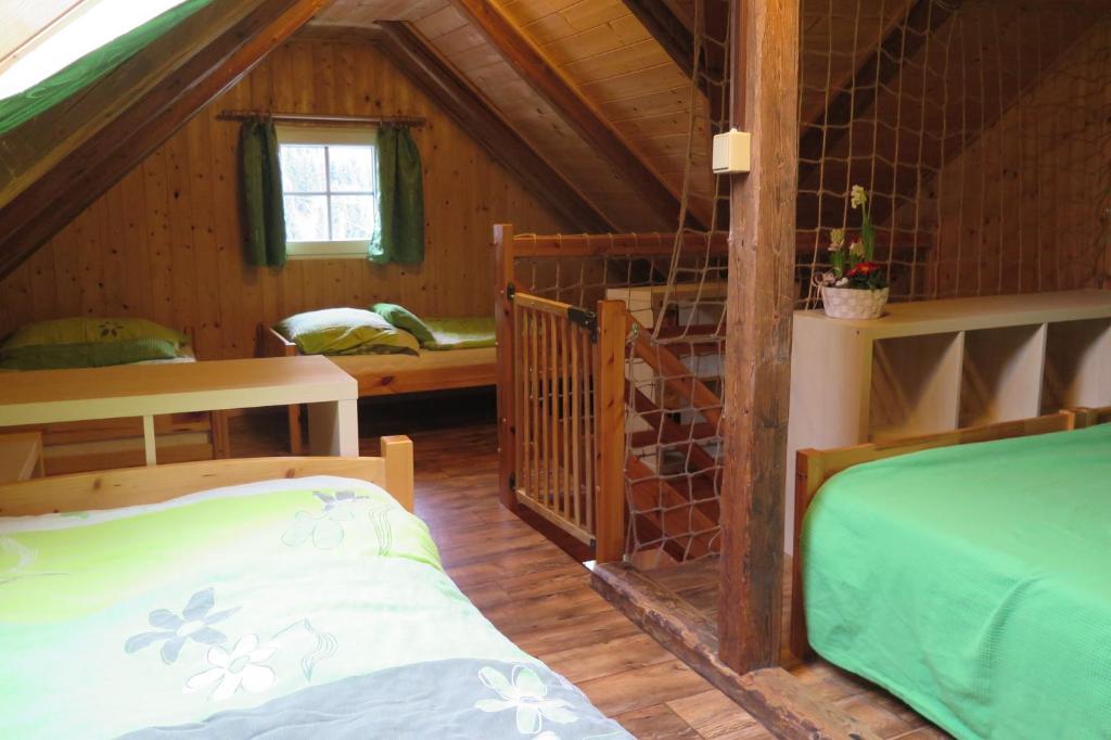 Postel nebo postele na pokoji v ubytování Apartments Skiareál U Vodárny Bedřichov