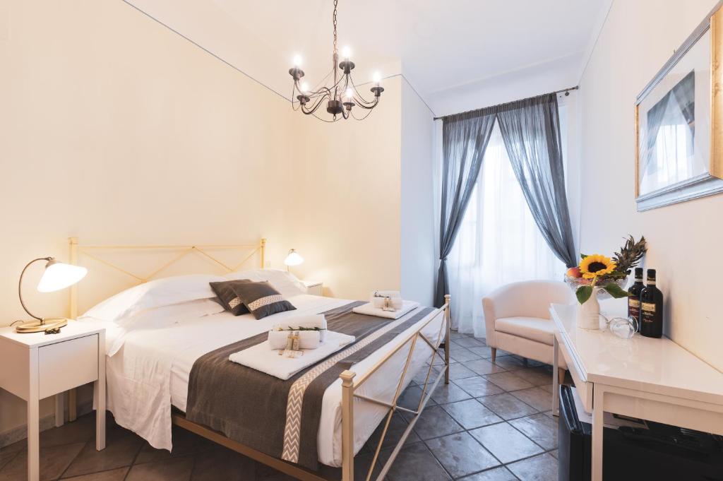 A bed or beds in a room at Albergo Giardino