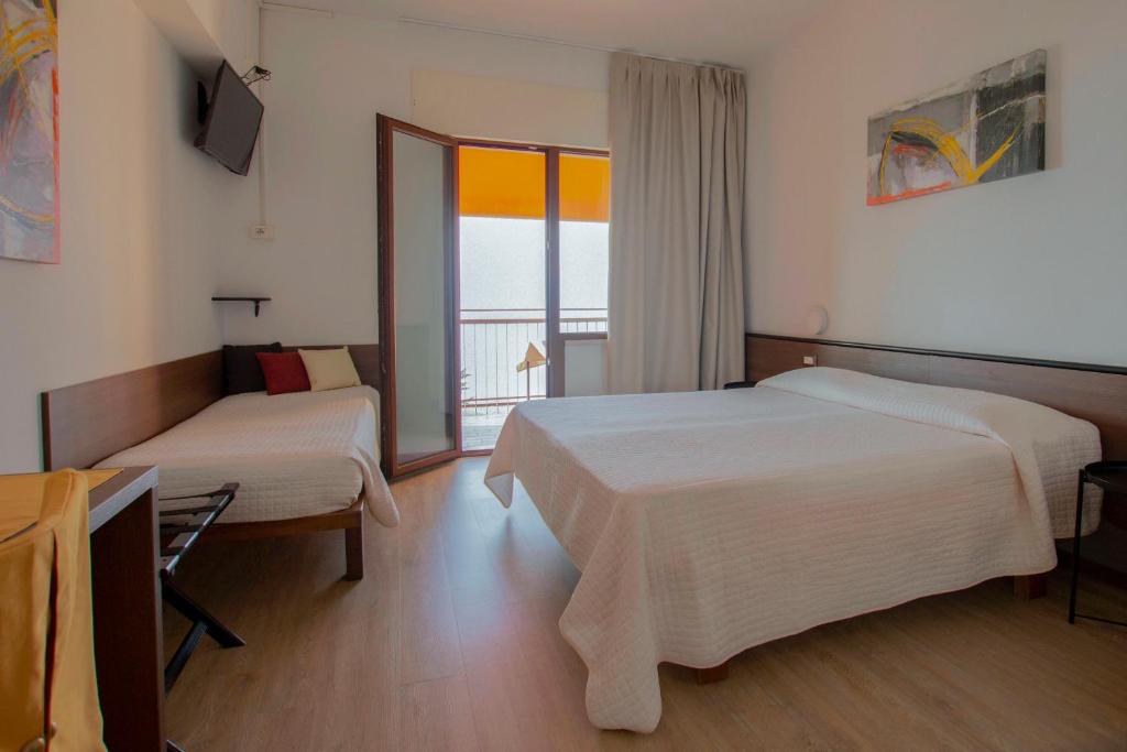 Postel nebo postele na pokoji v ubytování Hotel San Zeno
