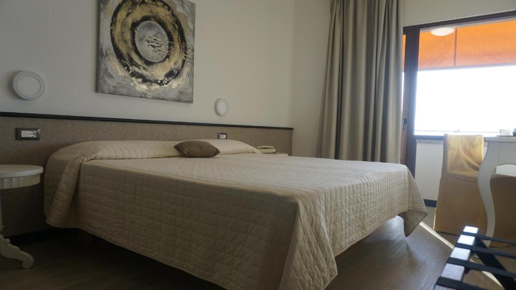 Postel nebo postele na pokoji v ubytování Hotel San Zeno