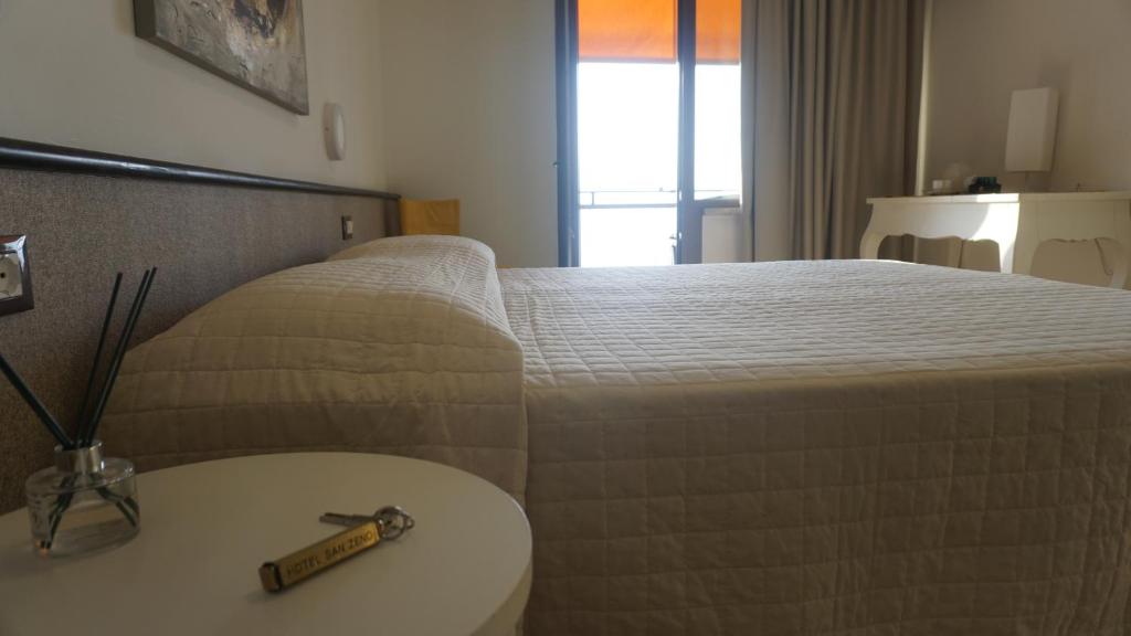 Postel nebo postele na pokoji v ubytování Hotel San Zeno