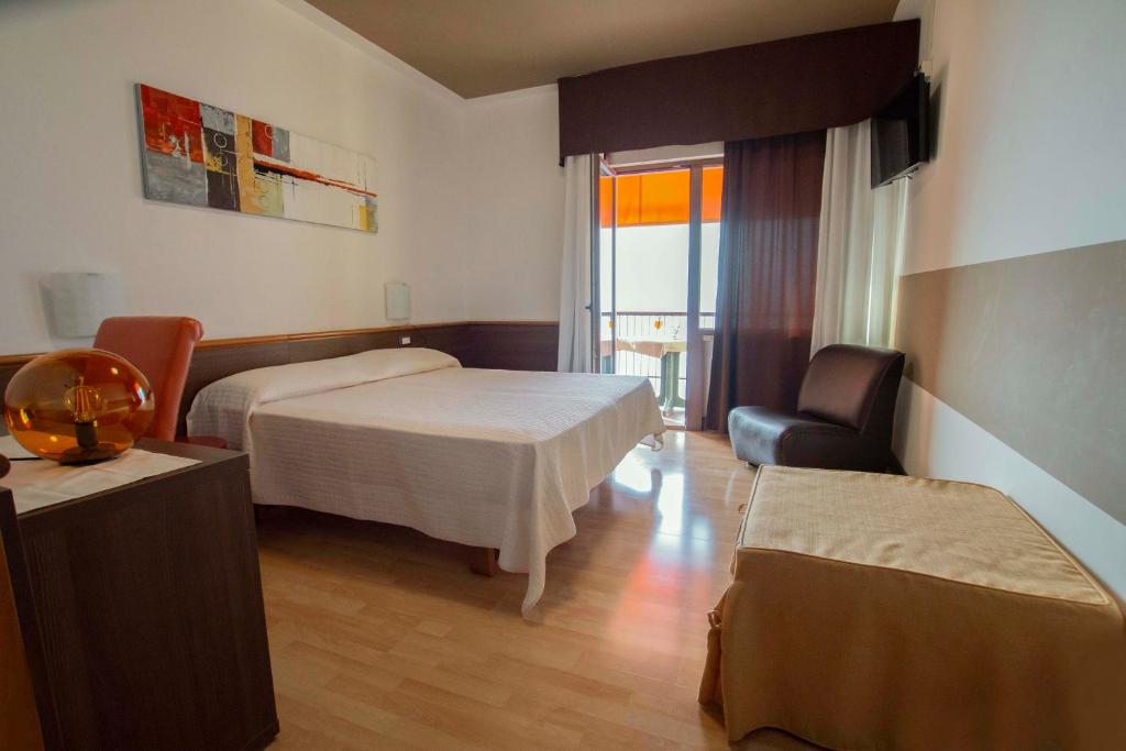 Postel nebo postele na pokoji v ubytování Hotel San Zeno