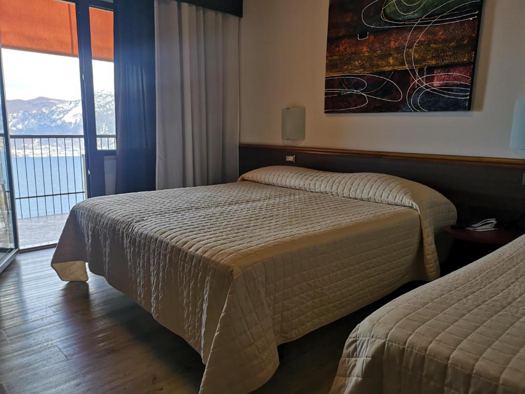 Postel nebo postele na pokoji v ubytování Hotel San Zeno