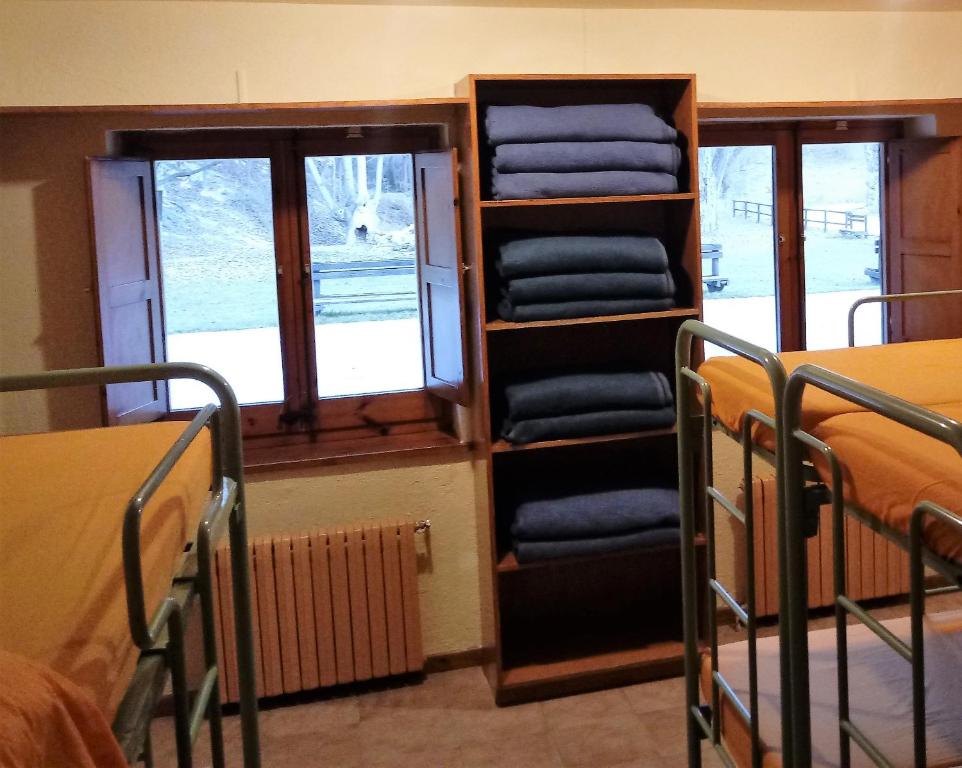 Postel nebo postele na pokoji v ubytování Alberg-Casa De Colònies Ridolaina