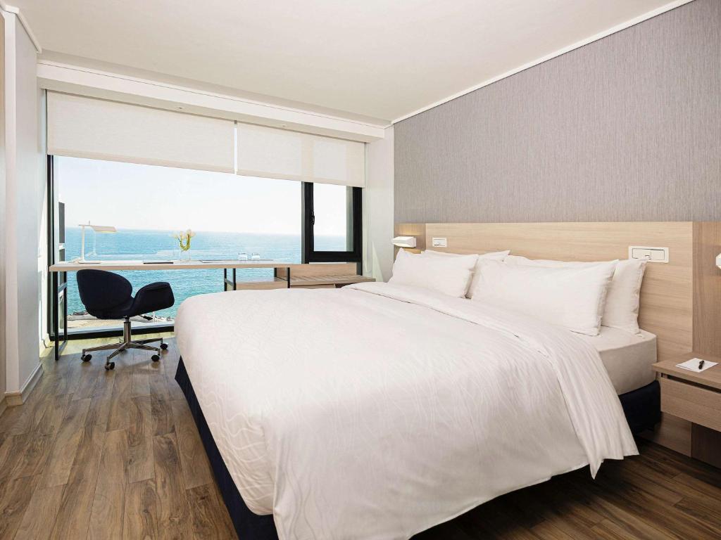 Cama o camas de una habitación en Pullman Vina del Mar San Martin