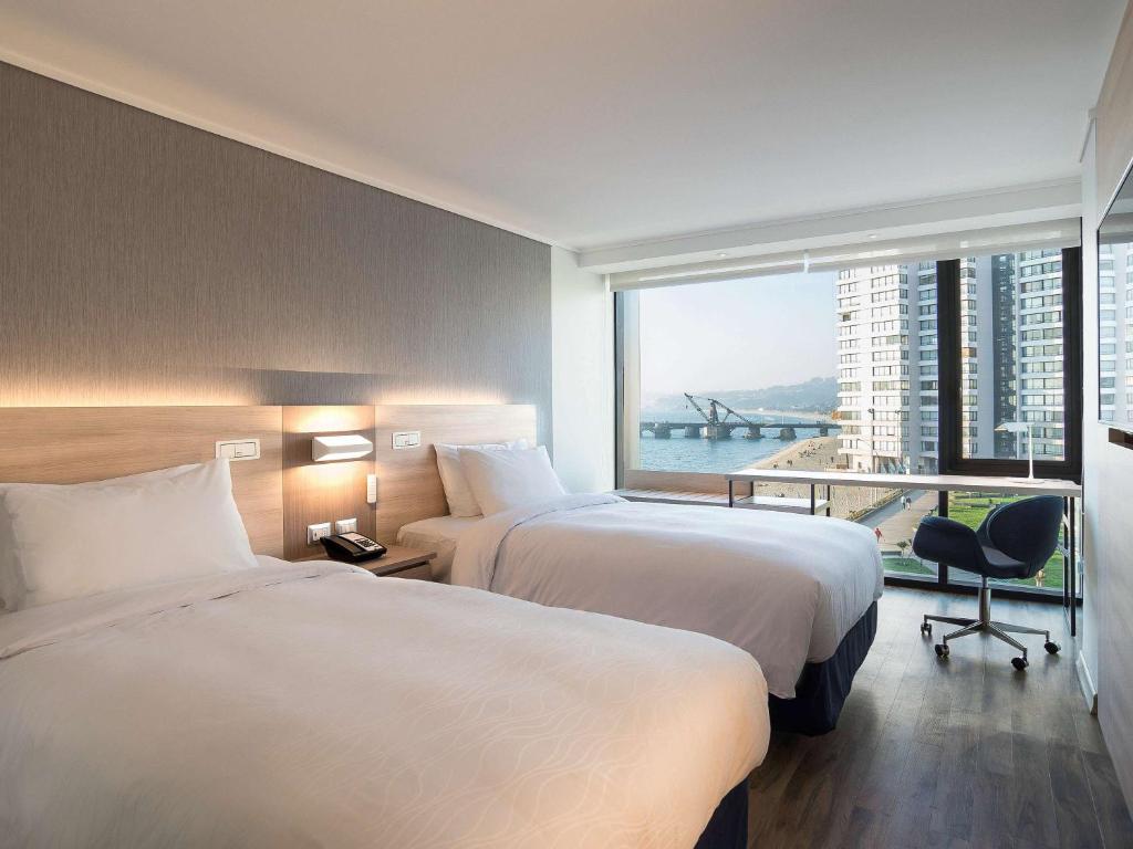Cama o camas de una habitación en Pullman Vina del Mar San Martin