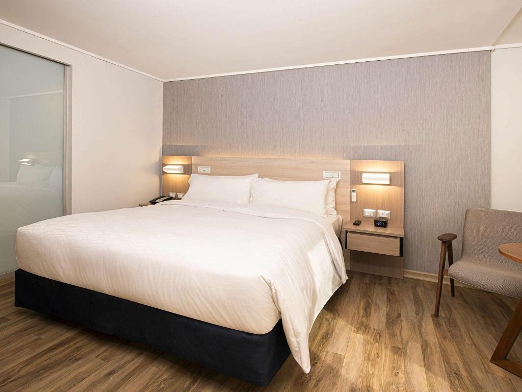 Cama o camas de una habitación en Pullman Vina del Mar San Martin
