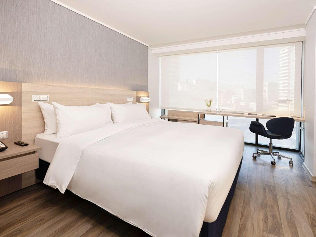 Cama o camas de una habitación en Pullman Vina del Mar San Martin