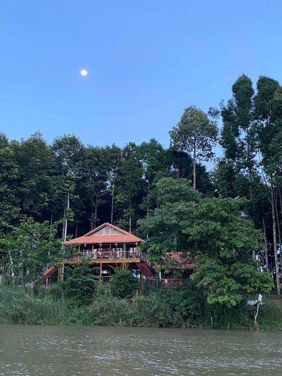 a house on the banks of a river at Cát Tiên Riverside in Tân Phú