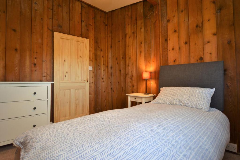 Postel nebo postele na pokoji v ubytování Scallopshell Lodge