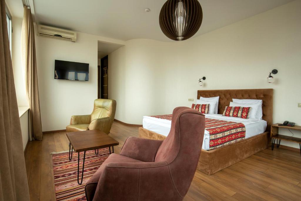 Postel nebo postele na pokoji v ubytování Hotel Flower