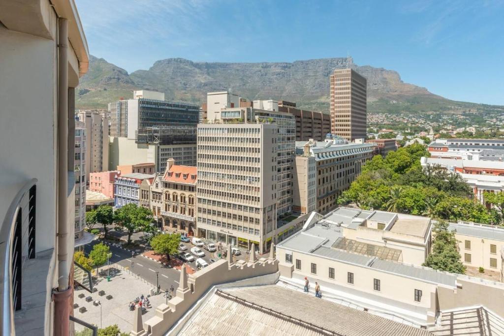 a view of a city with mountains in the background at Piazza 100D in Cape Town