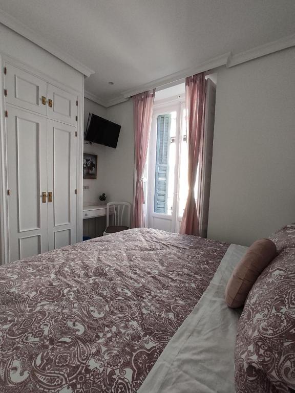 Postel nebo postele na pokoji v ubytování Hostal Alfaro